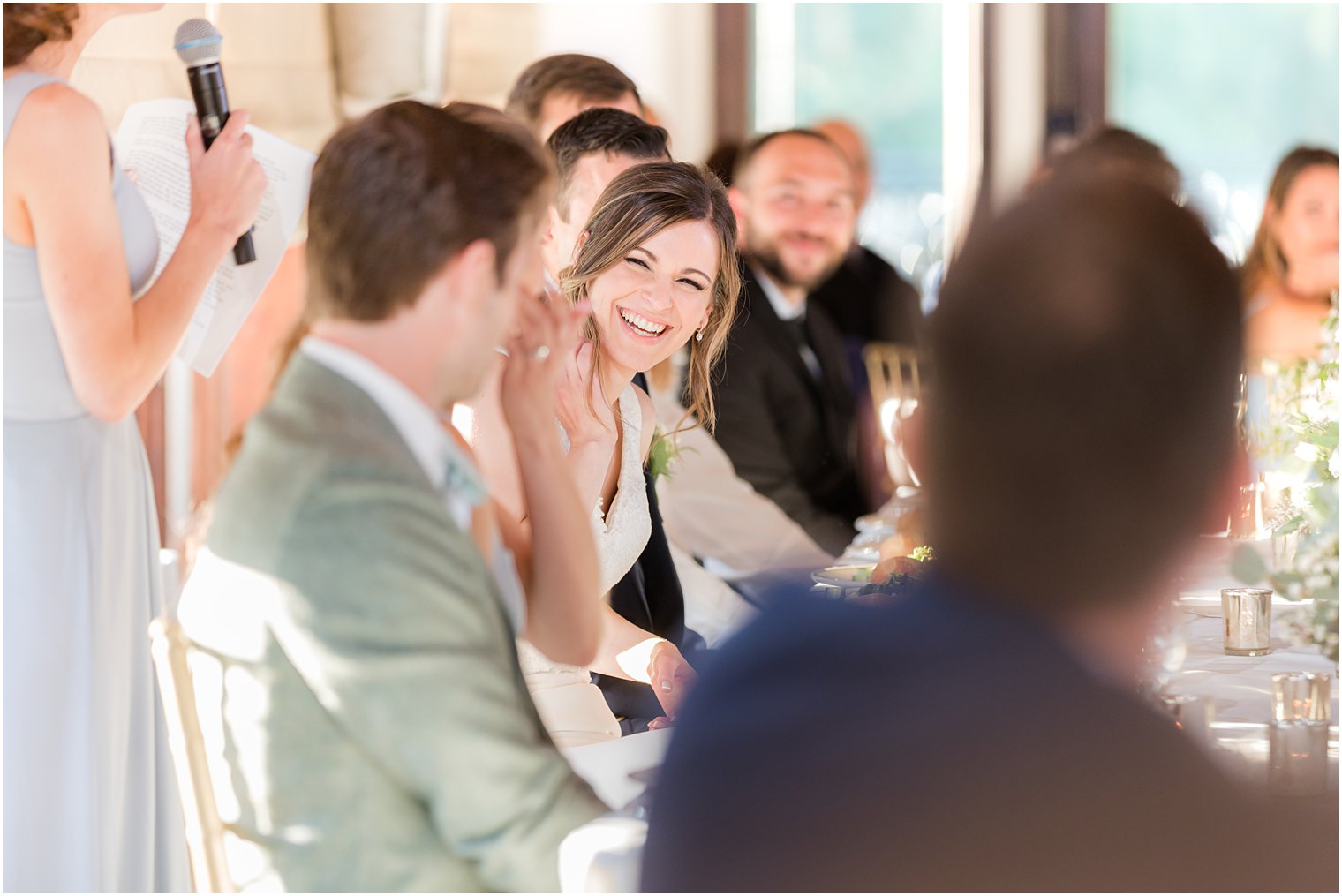 bride laughs with guests during Morristown NJ wedding reception