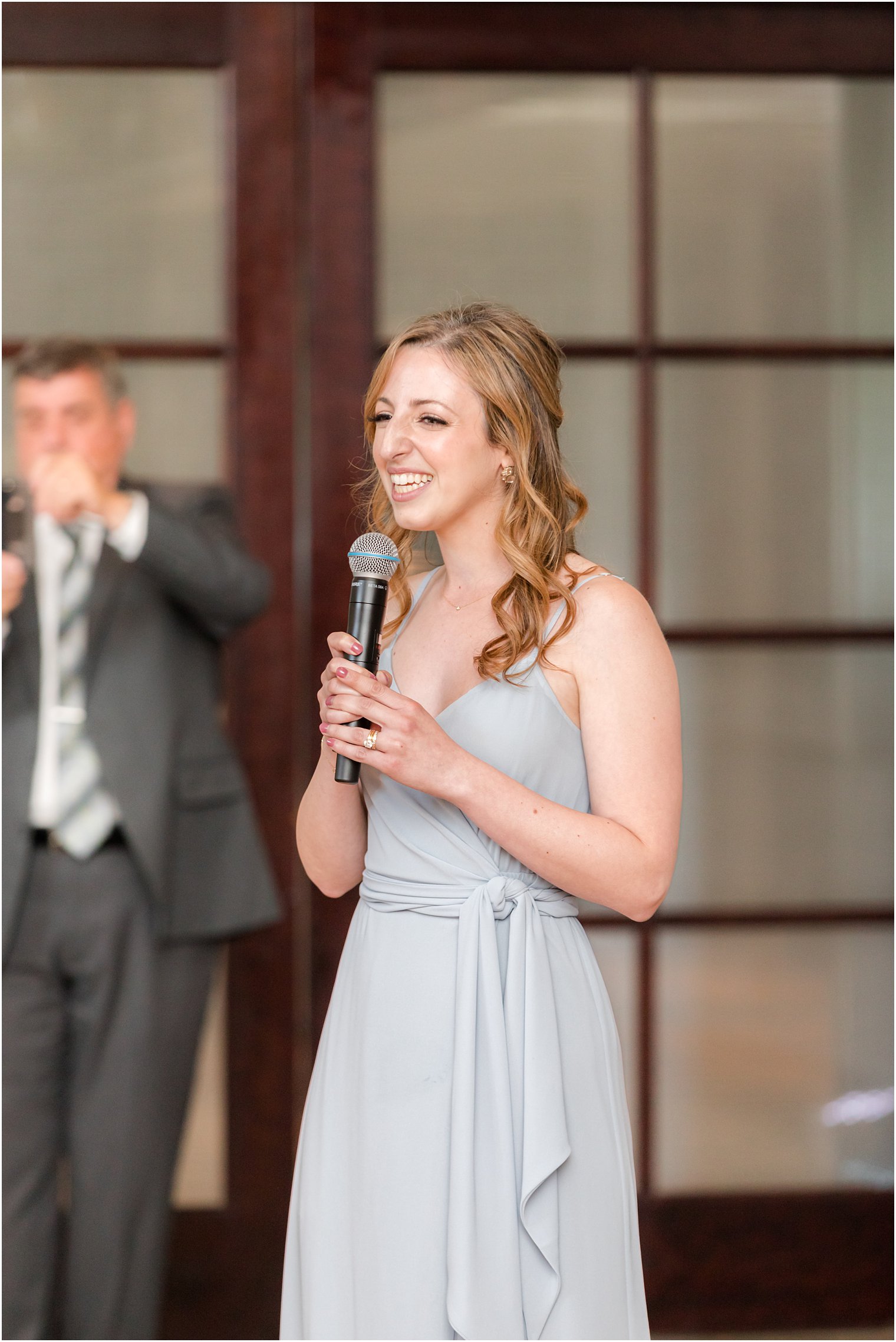 bridesmaid sings for wedding dance