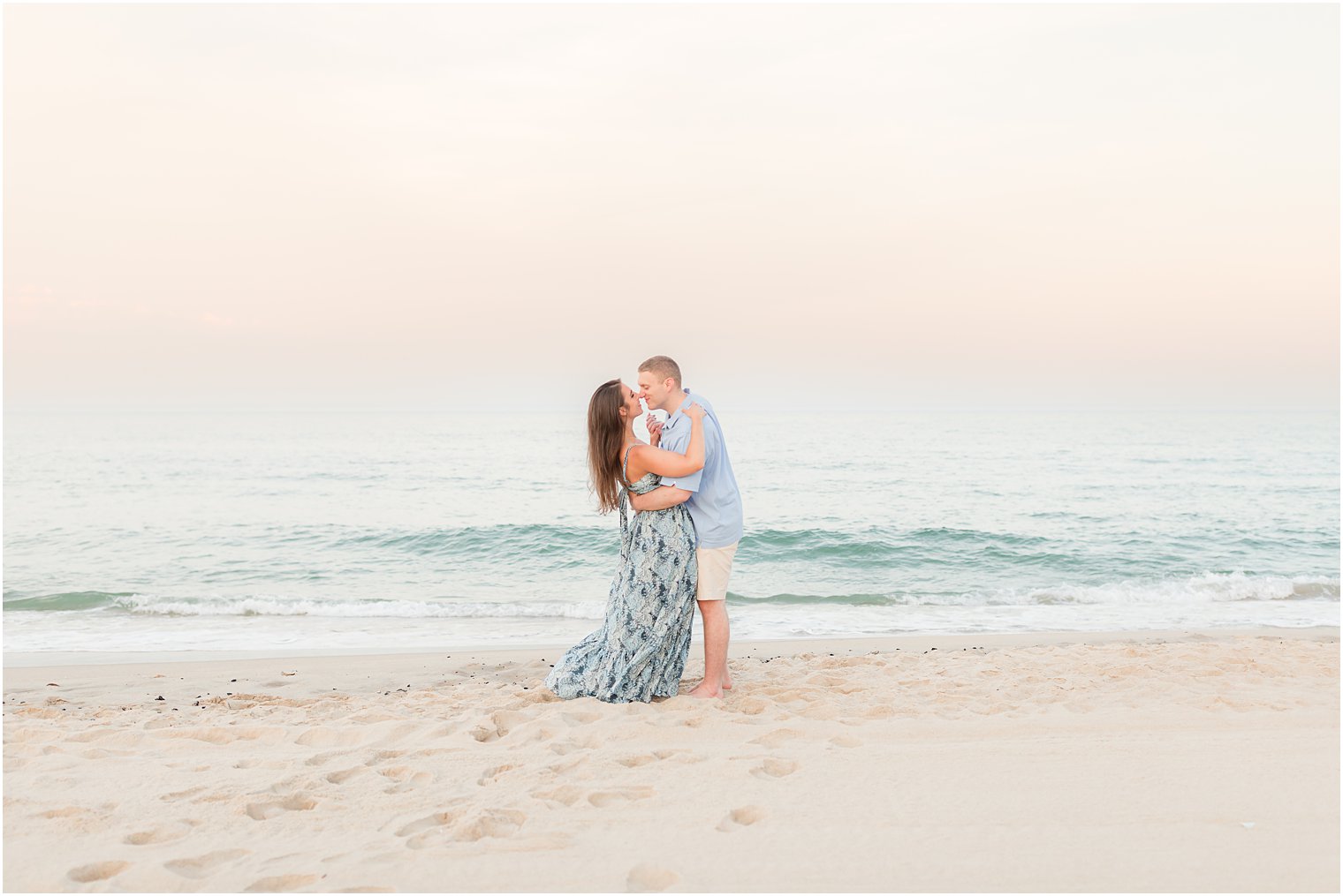 couple kisses on beach in Spring Lake NJ