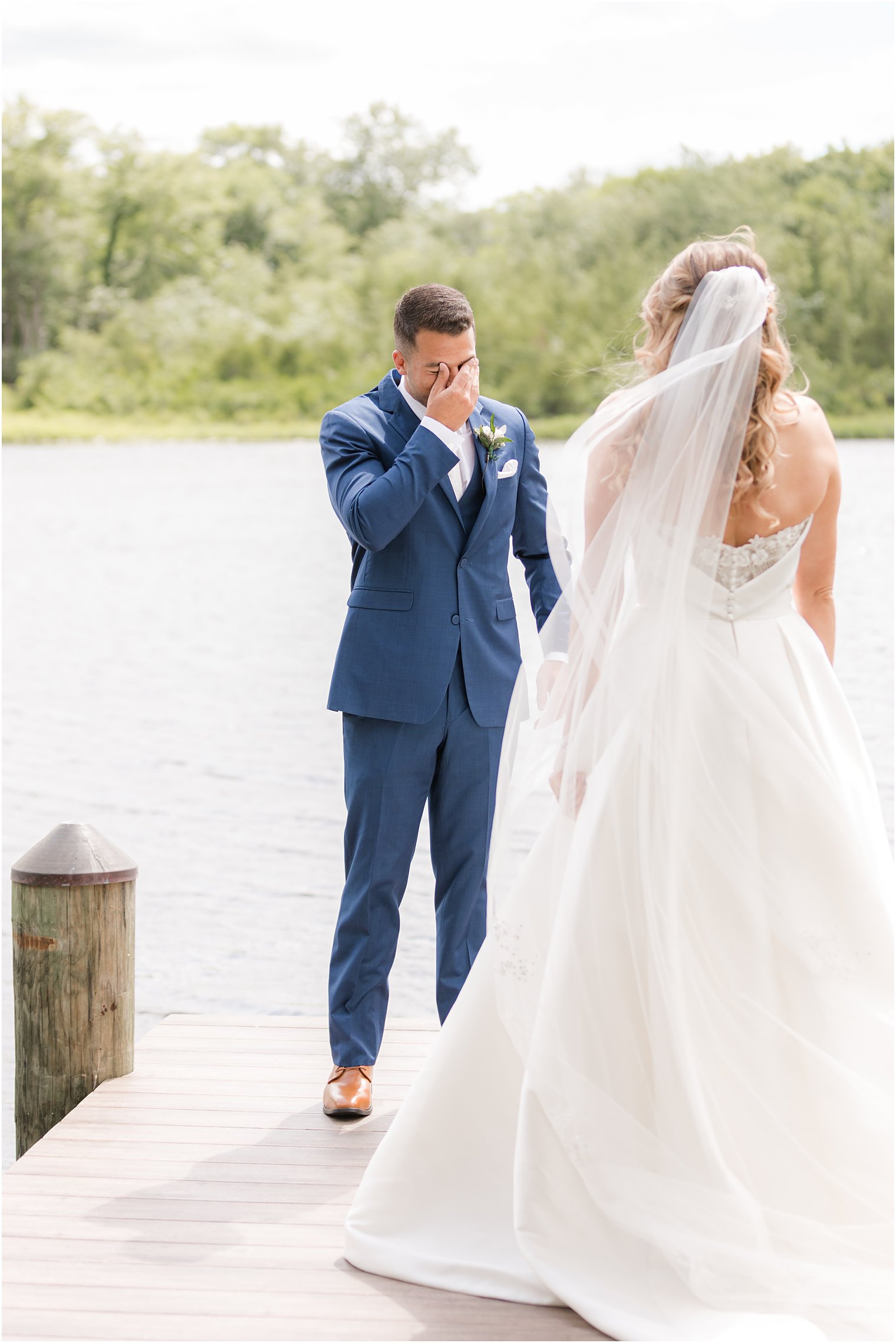 groom cries during first look seeing bride for first time
