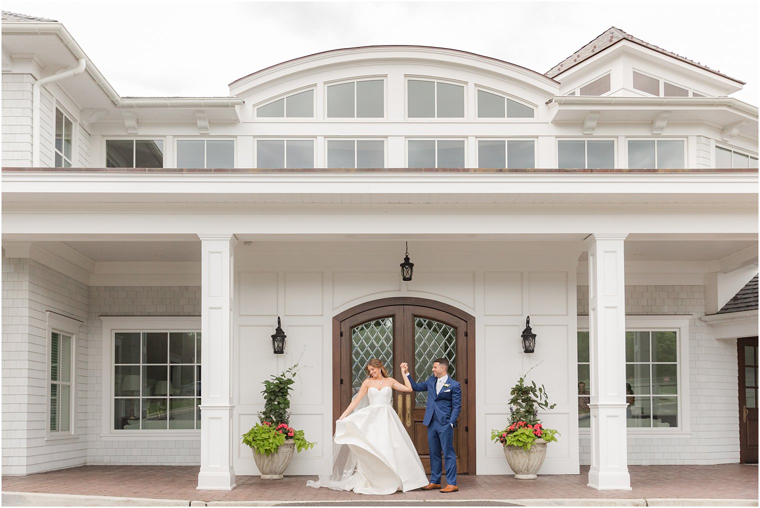 bride and groom twirl outside The Mill Lakeside Manor