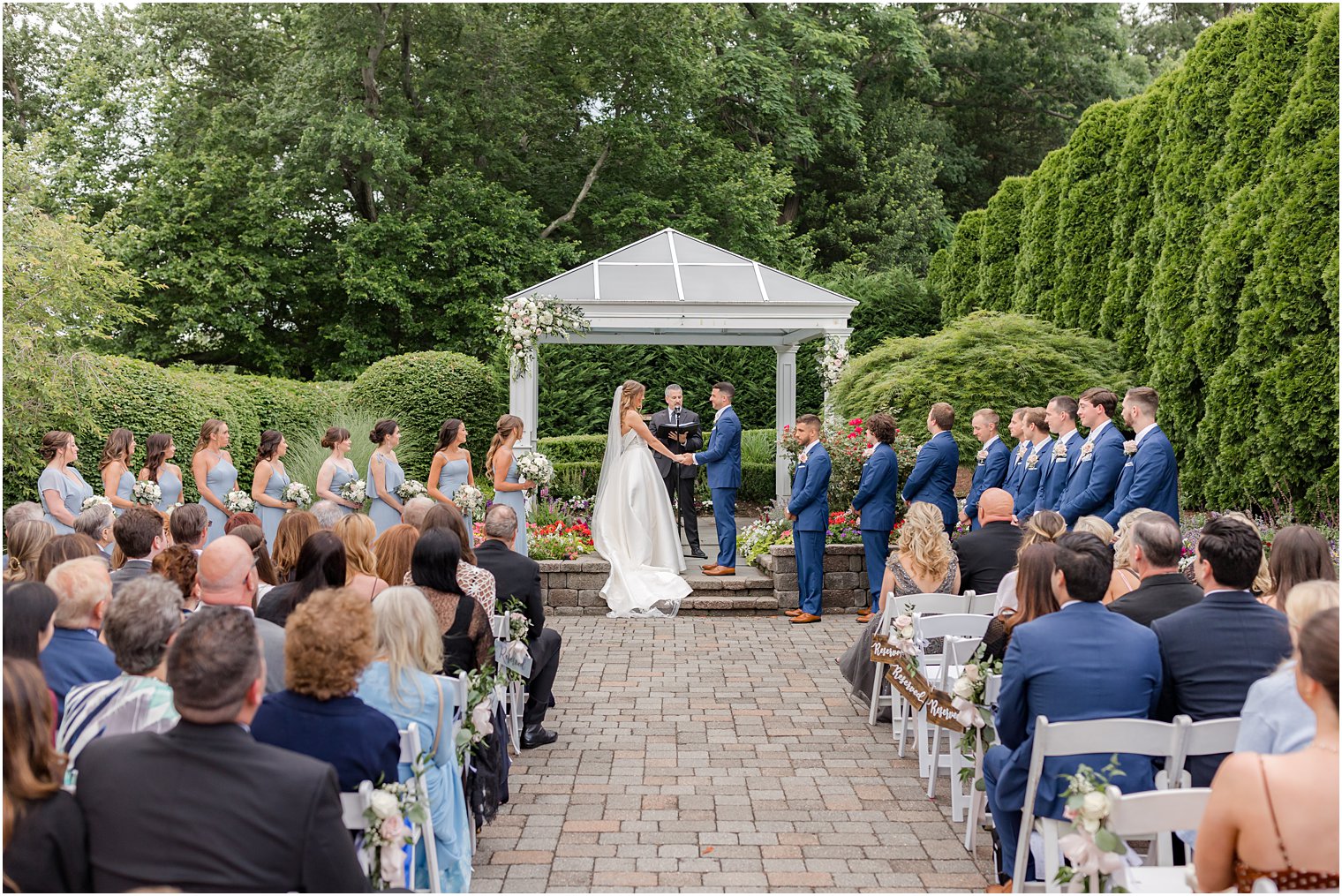 Spring Lake NJ wedding ceremony in gardens of The Mill Lakeside Manor