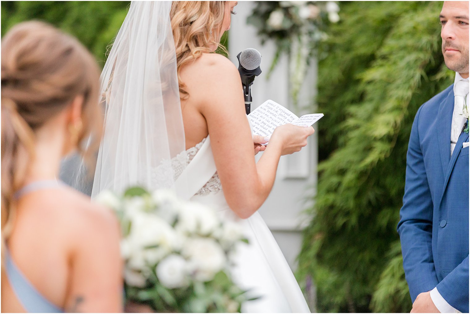 bride reads handwritten vows during Spring Lake NJ wedding ceremony