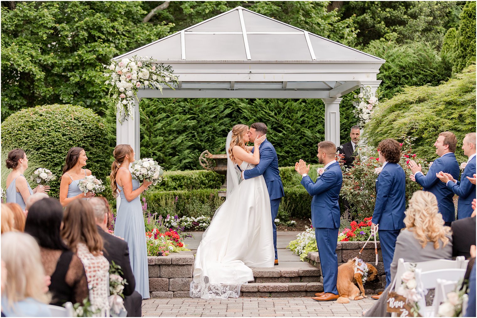 newlyweds kiss during Spring Lake NJ wedding ceremony