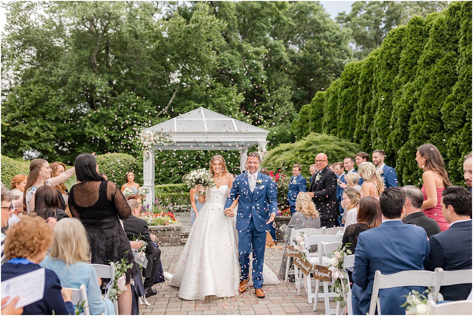 couple turns to leave through confetti exit 