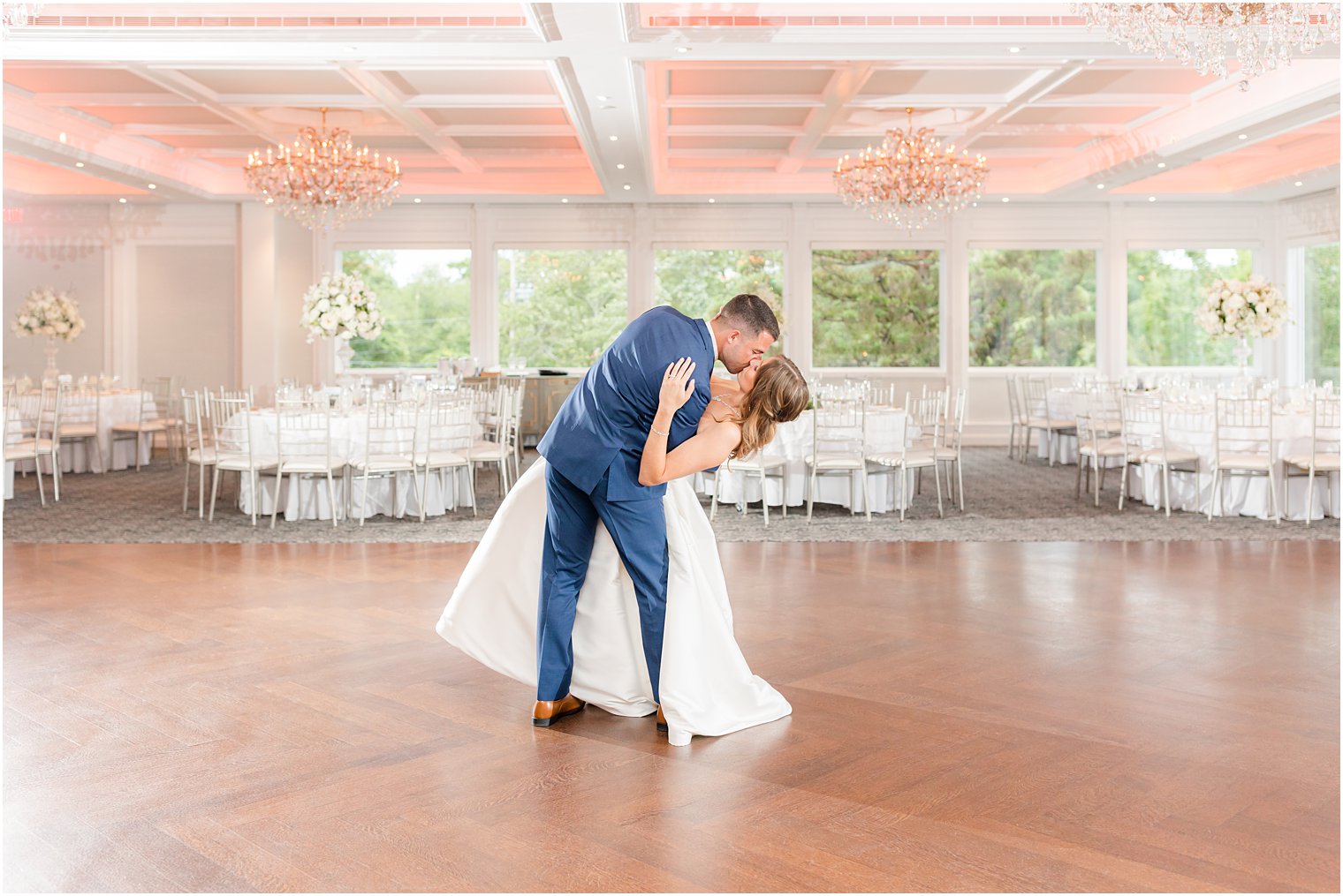 groom dips bride during kiss at The Mill Lakeside Manor