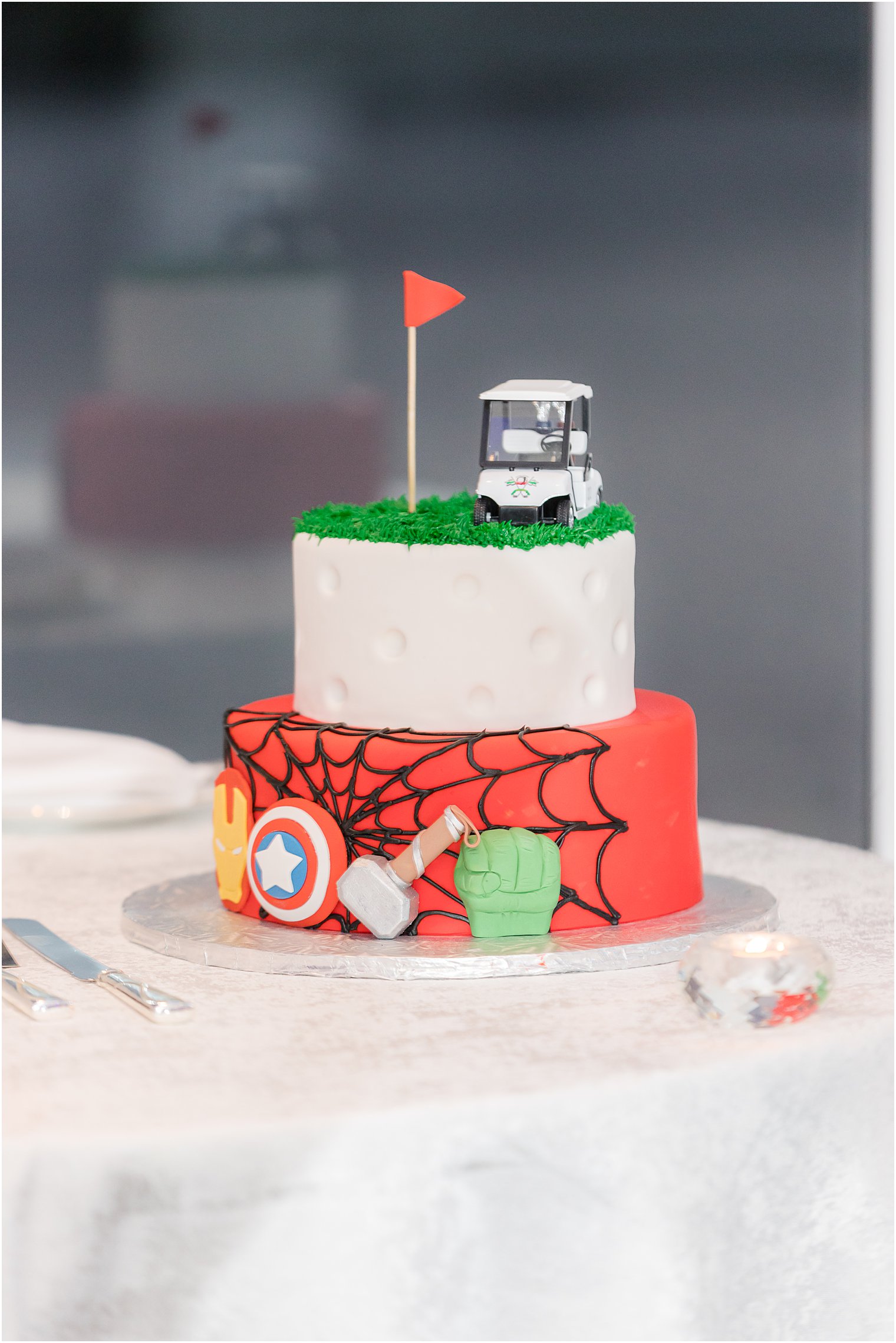 groom's cake featuring golf and Marvel figurines