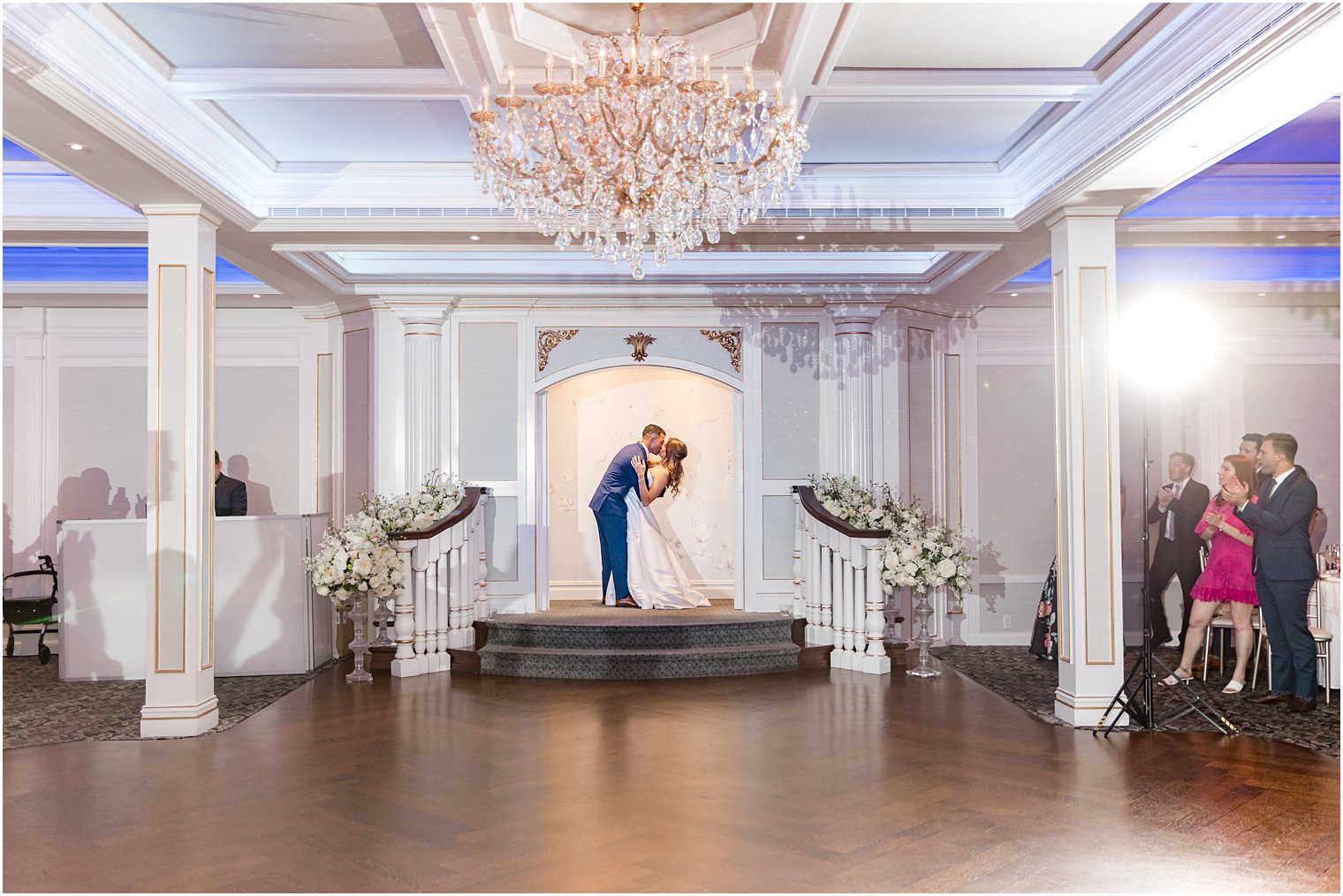 newlyweds kiss in entry way at The Mill Lakeside Manor