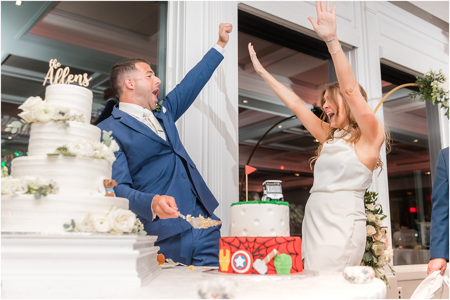 newlyweds cheer during cake cutting at Spring Lake NJ reception