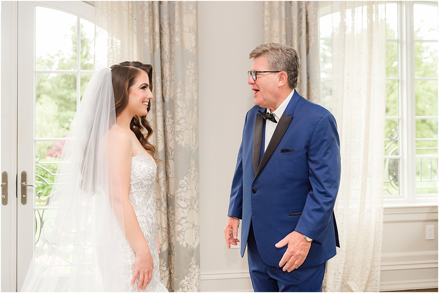 bride and dad have first look in bridal suite at Park Chateau Estate