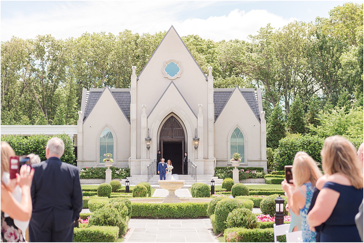 bride and dad walk down aisle in garden of Park Chateau Estate