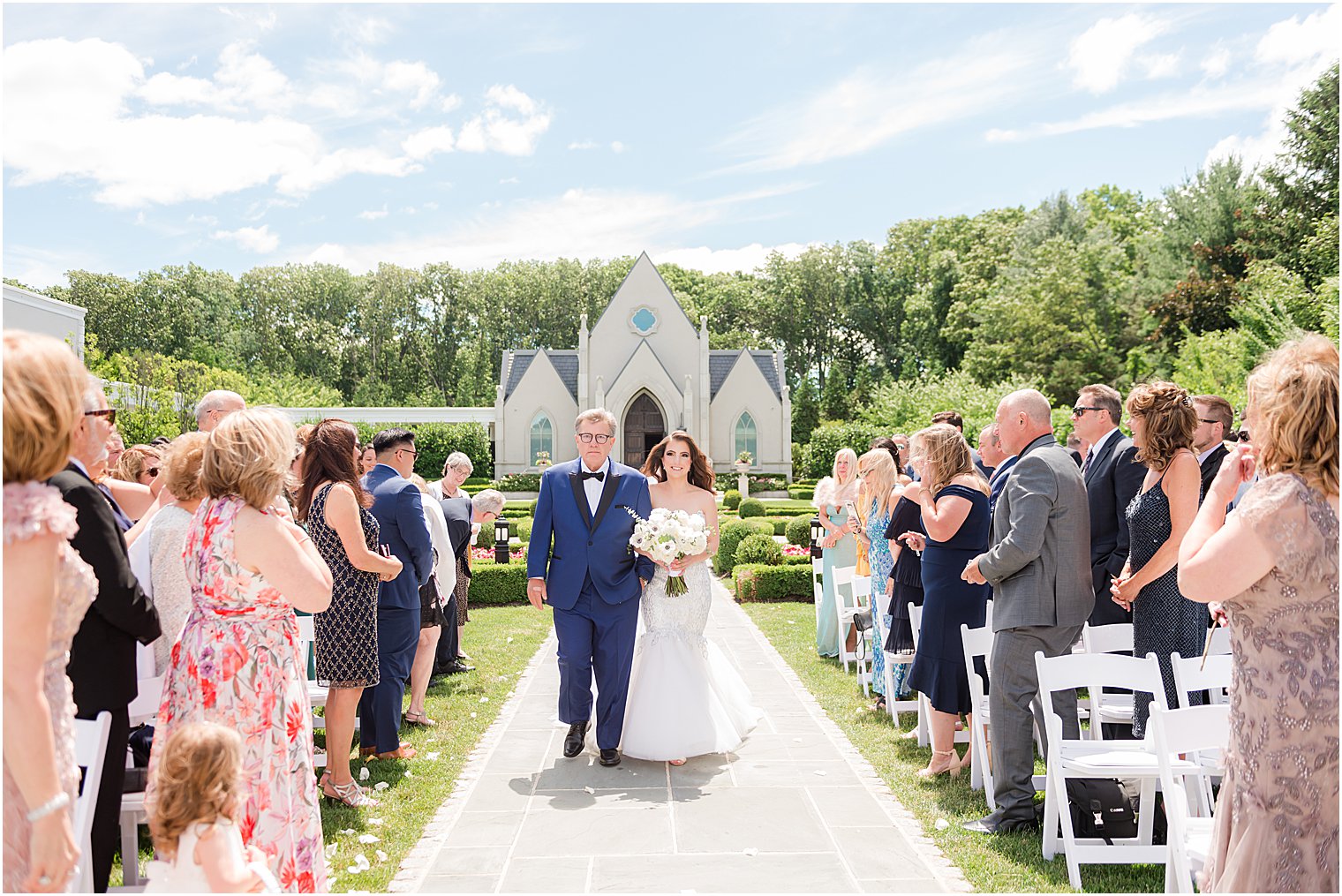 bride and dad enter wedding ceremony in New Jersey garden