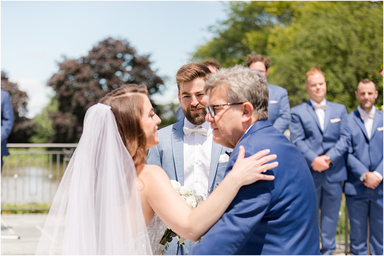 dad gives away bride during summer wedding ceremony at Park Chateau Estate