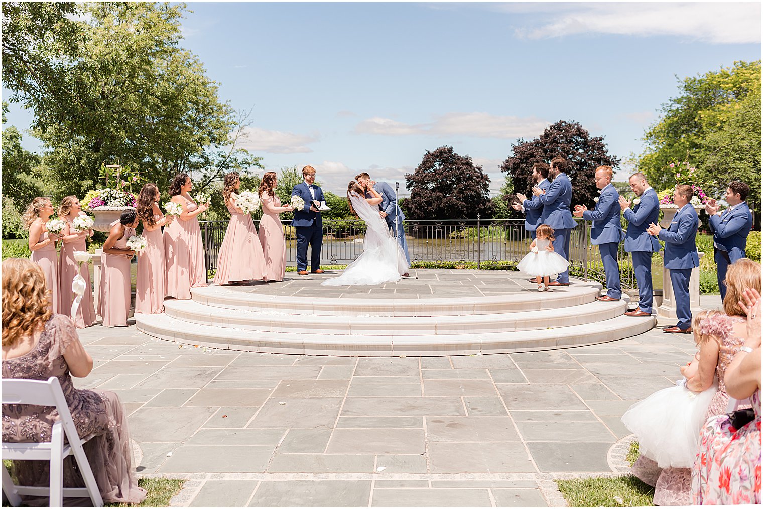 groom dips bride during kiss at Park Chateau Estate