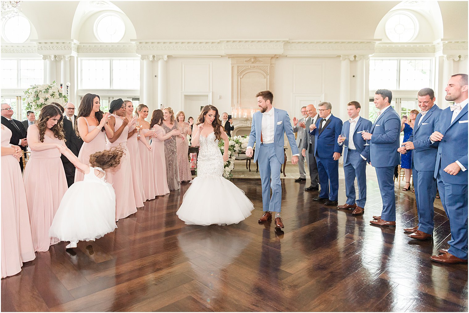 bride and groom dance with wedding party around them at Park Chateau Estate