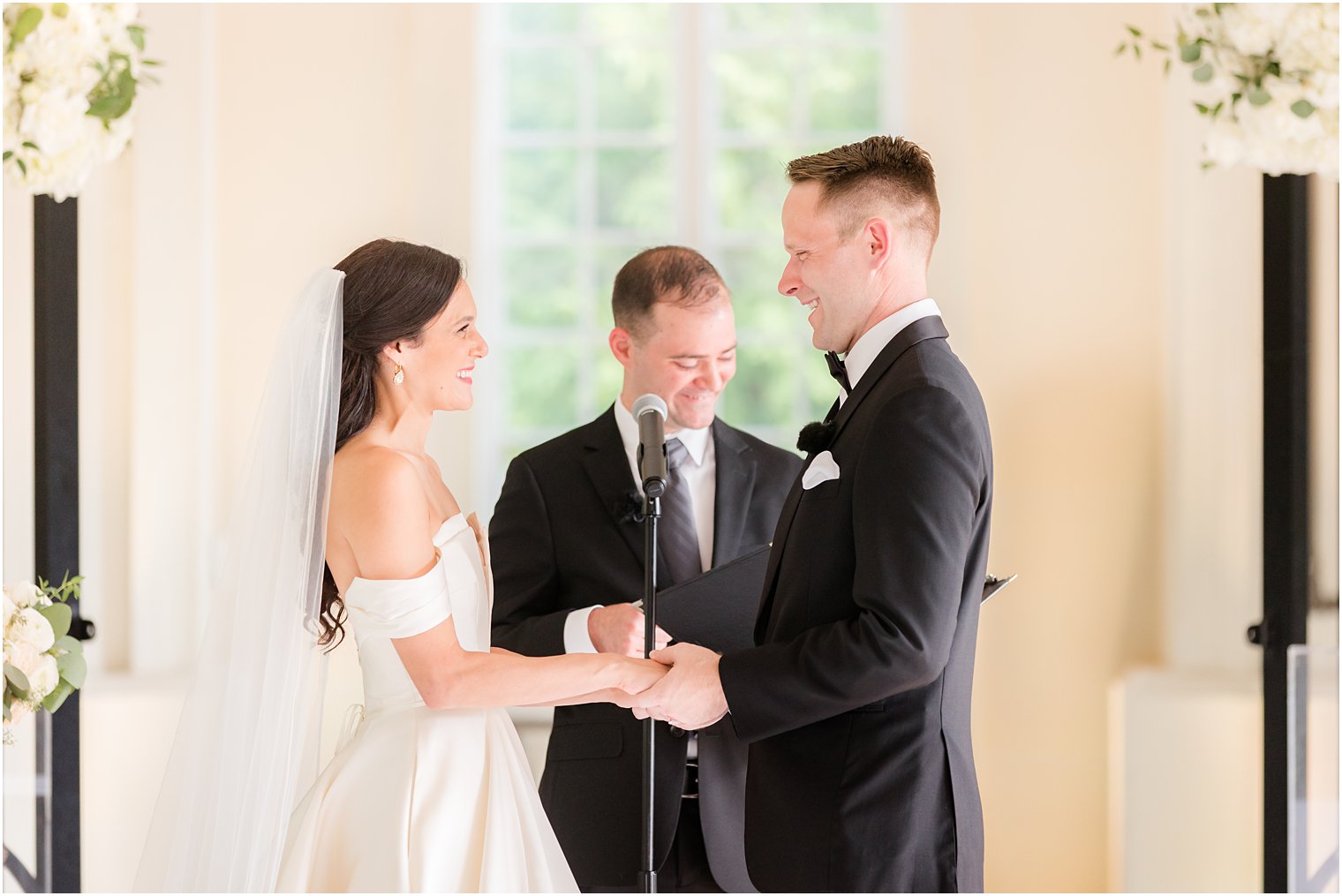 newlyweds exchange rings during ceremony at Shadowbrook at Shrewbsury chapel