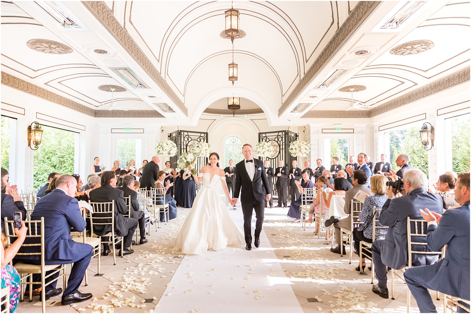 bride and groom leave wedding ceremony at Shadowbrook at Shrewbsury