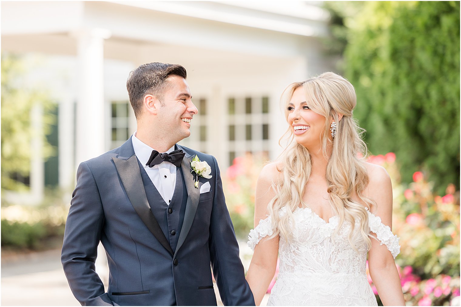 newlyweds smile together during NJ wedding photos