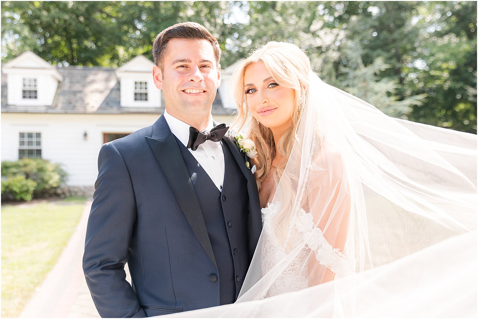 newlyweds smile standing together