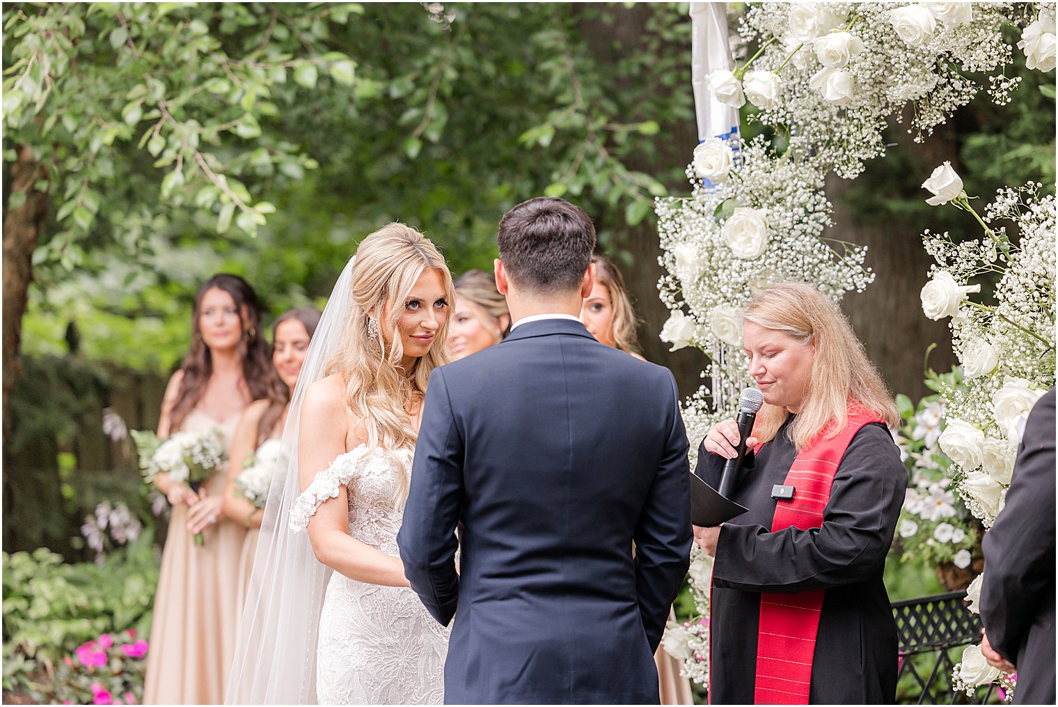 newlyweds exchange vows during Jewish ceremony in the gardens of The English Manor