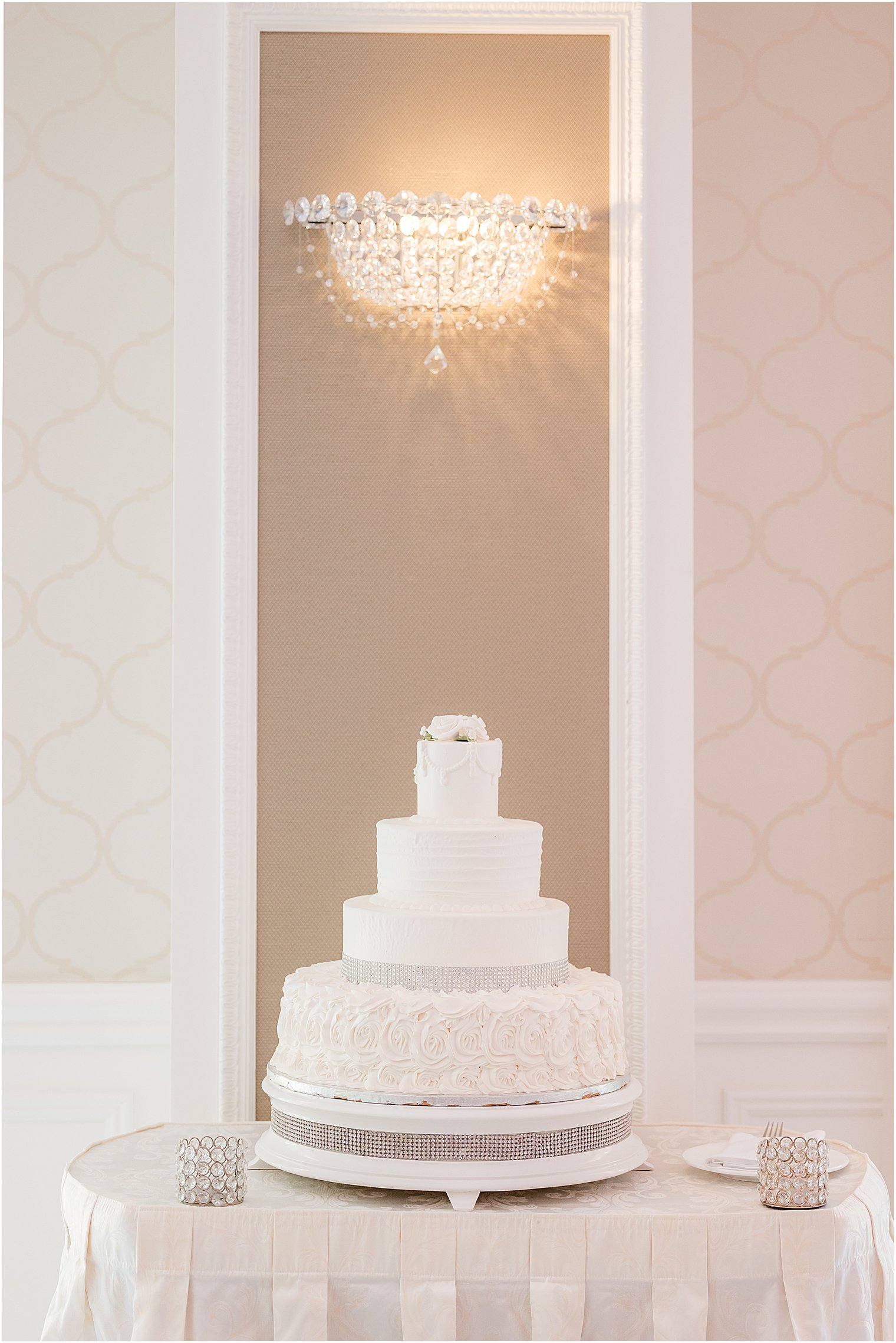 tiered wedding cake with white icing at The English Manor
