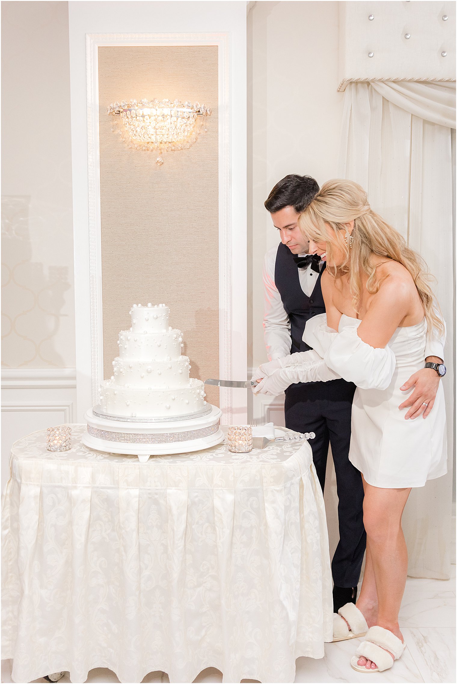 bride and groom cut wedding cake at The English Manor