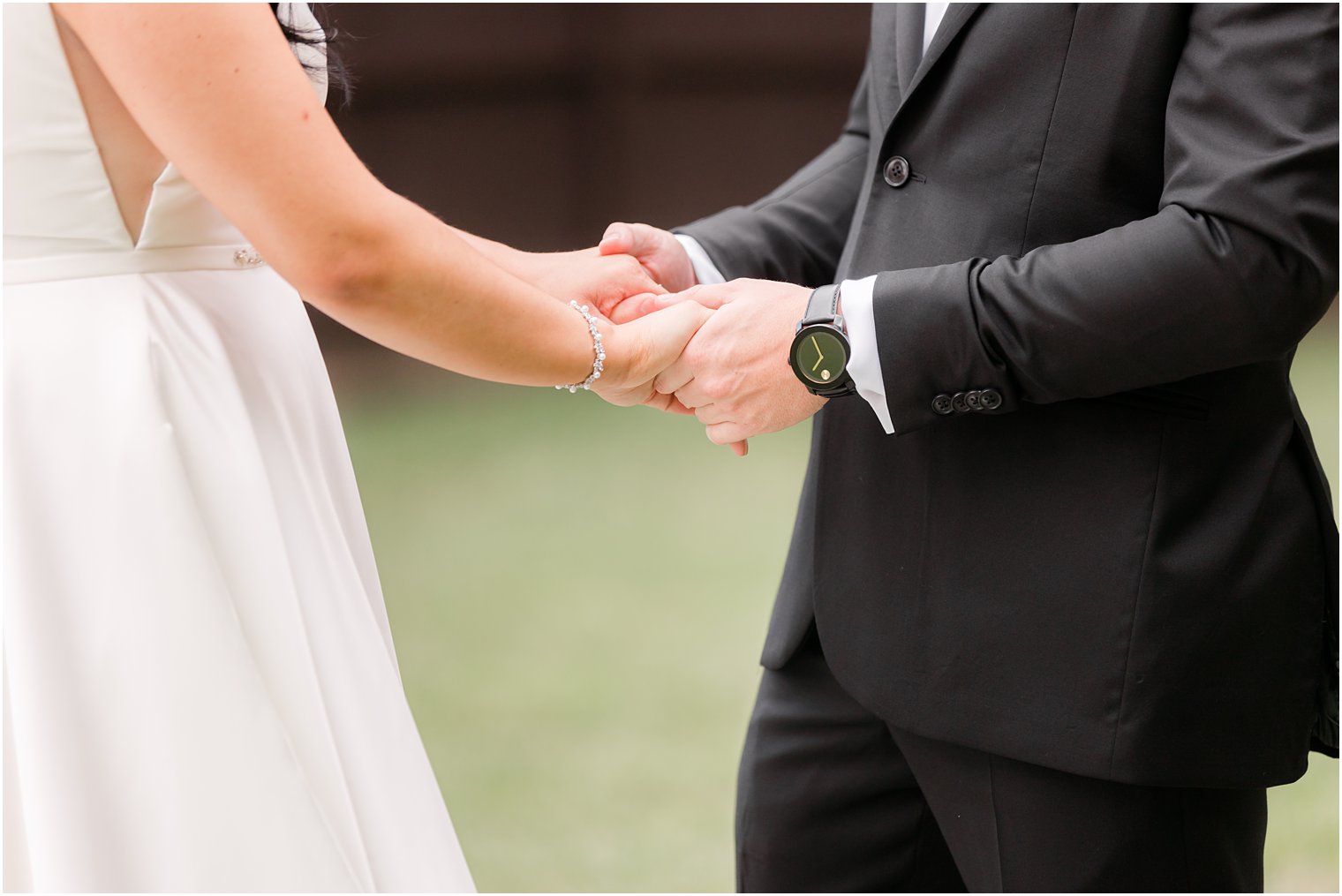 couple holds hands during first look in New Jersey