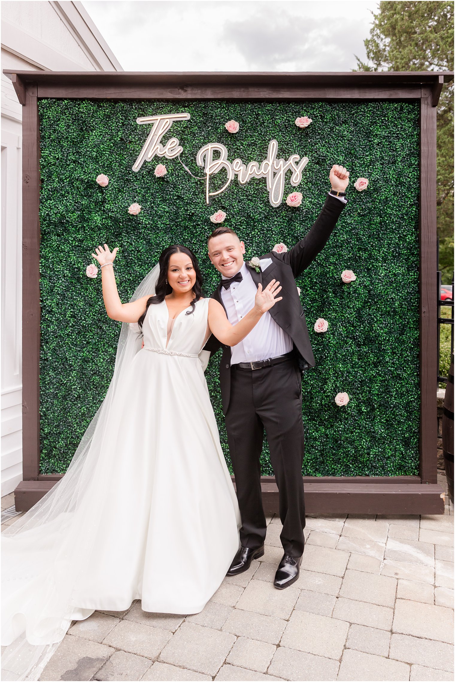 newlyweds cheer by custom sign at reception 