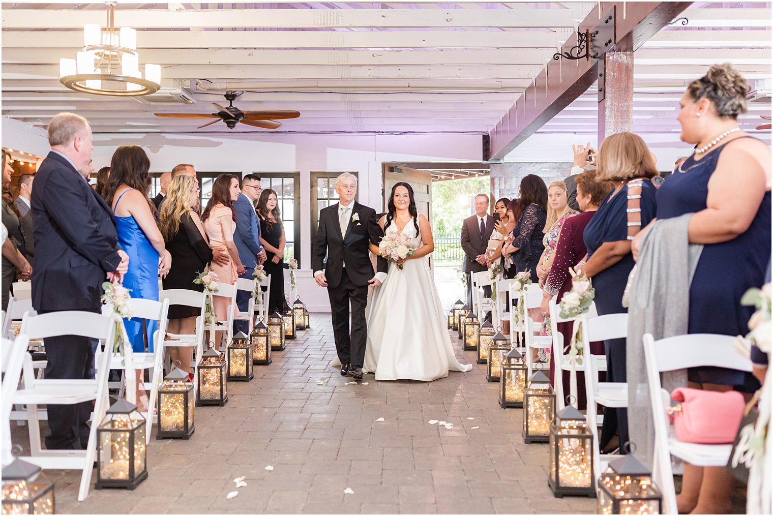 bride enters rustic wedding ceremony at Hamilton Manor