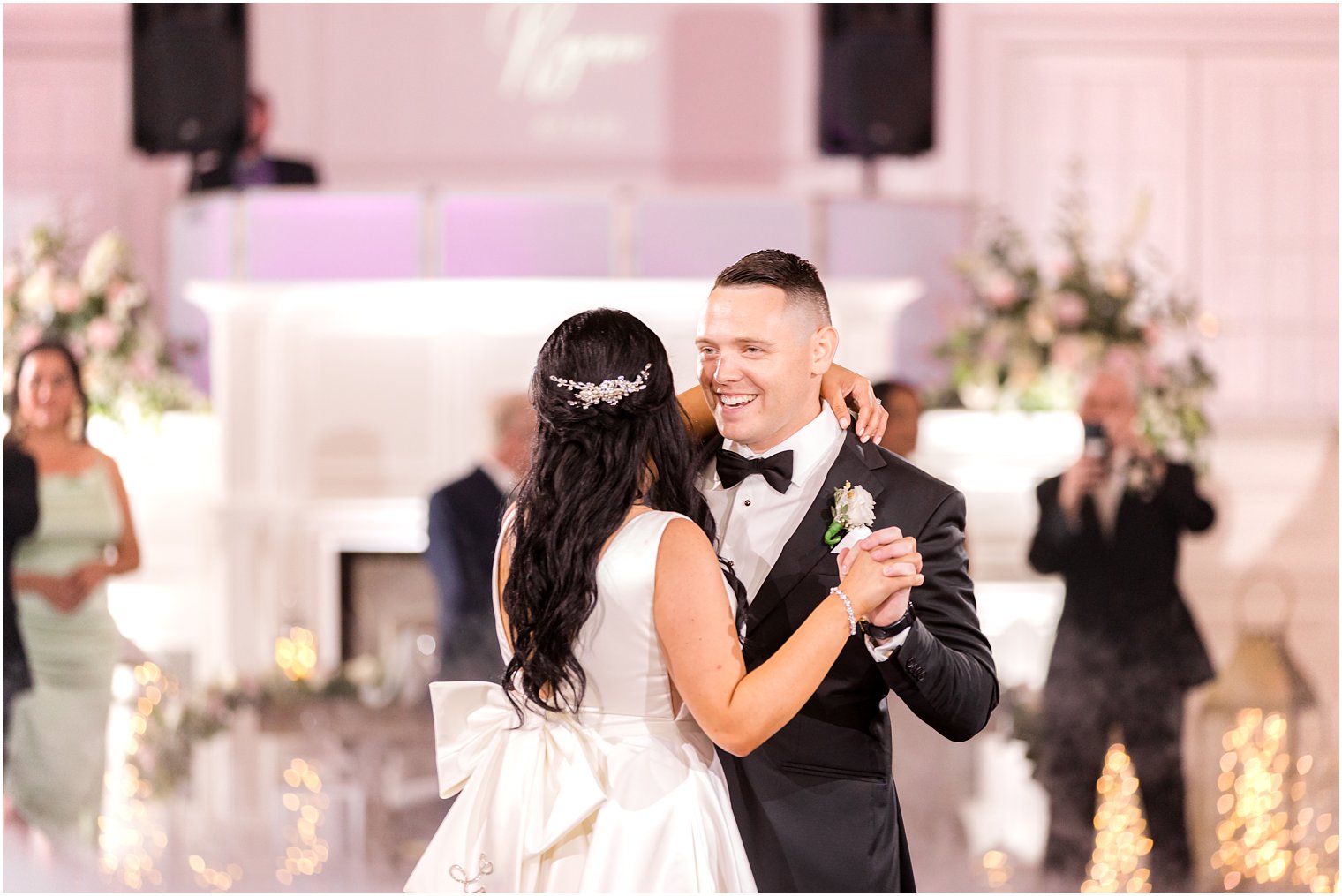 groom dances with bride during wedding reception in New Jersey