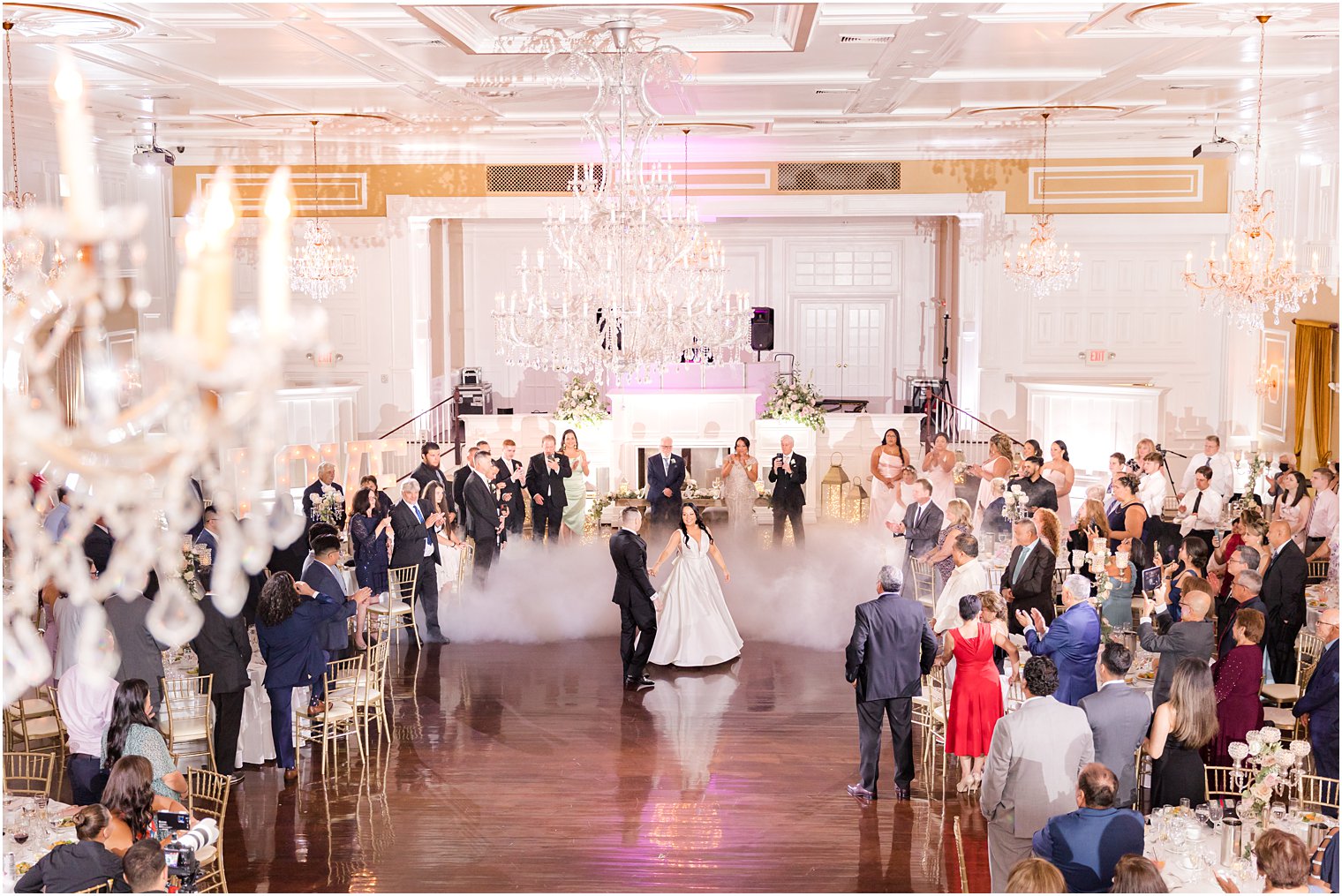 bride and groom dance with fog around them at Hamilton Manor