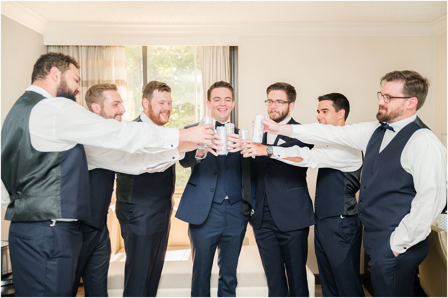 groom and groomsmen toast in suite at Indian Trail Club