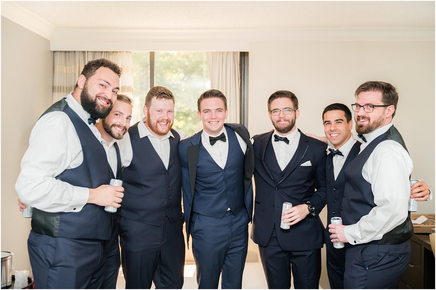 groom hugs groomsmen at Indian Trail Club