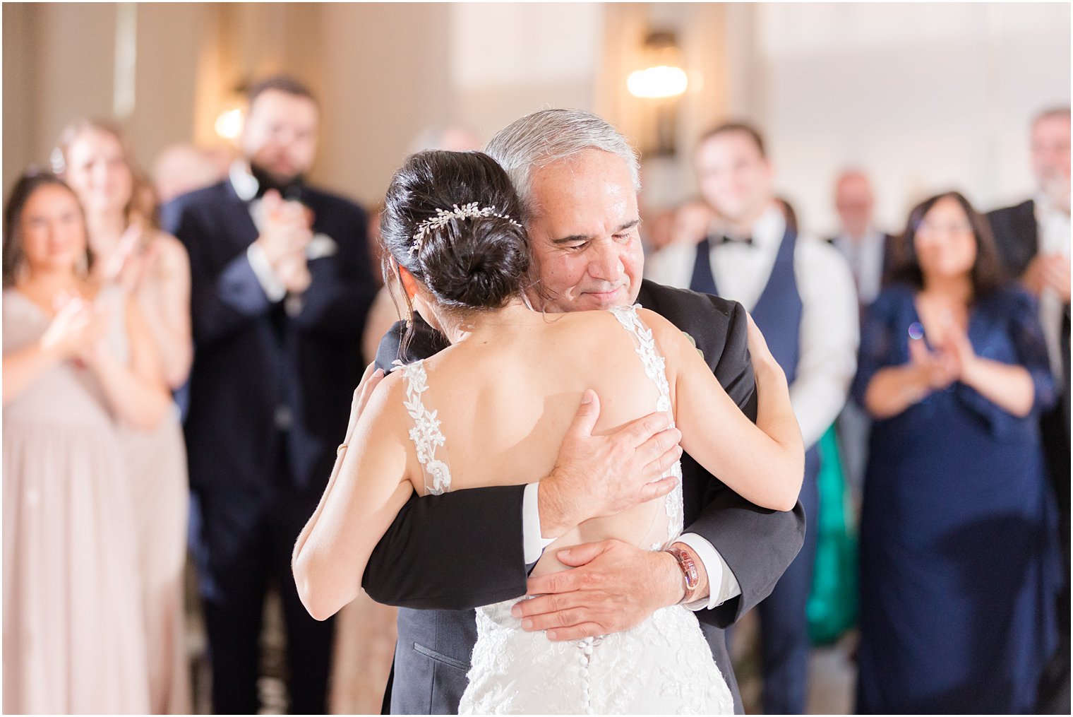 dad hugs bride during dance in New Jersey