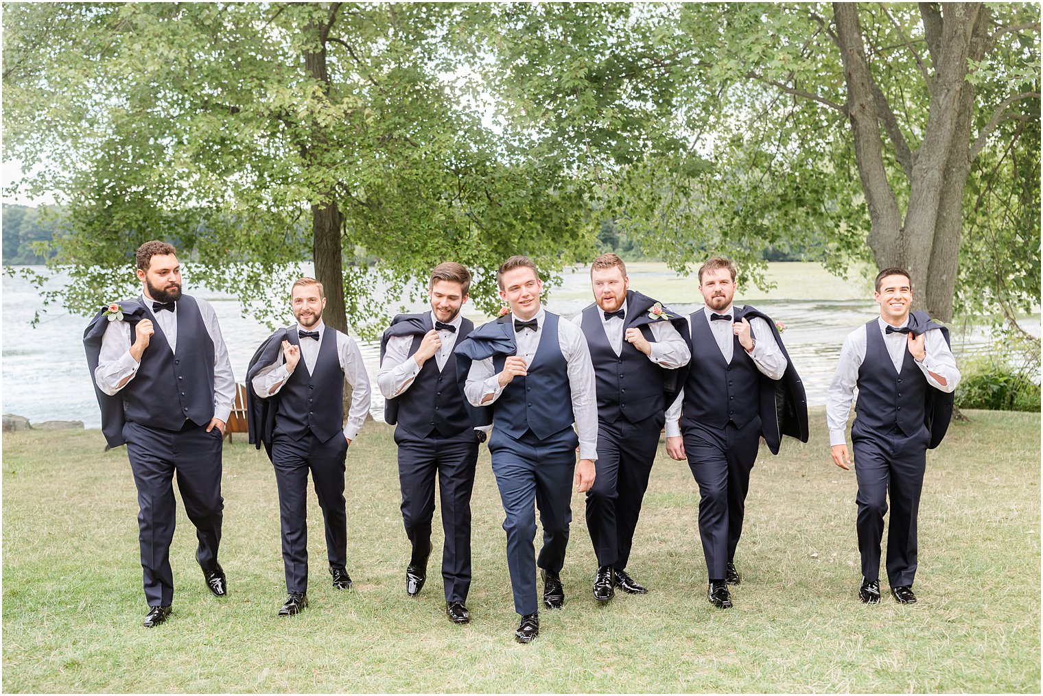 groom walks with groomsmen at Indian Trail Club