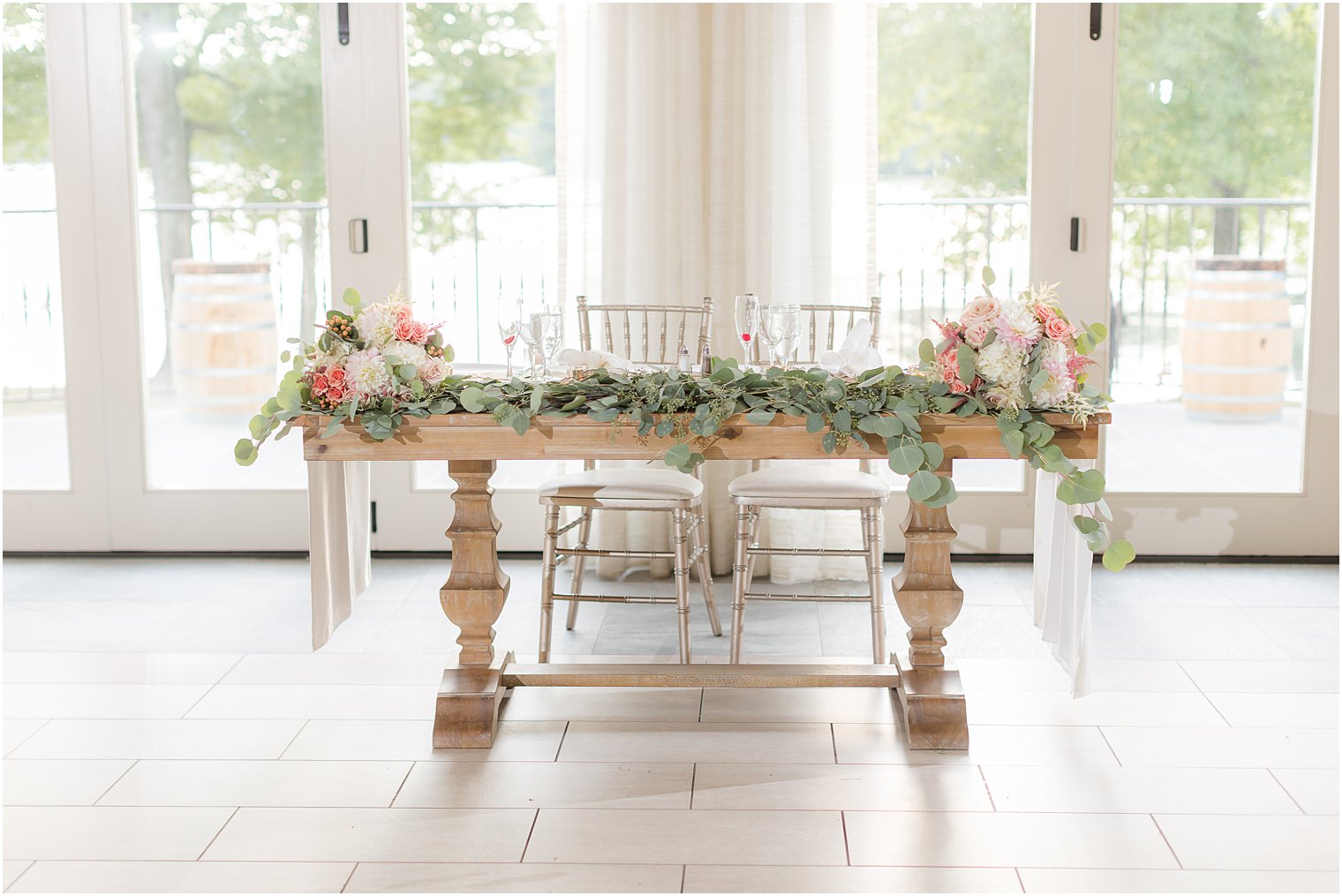 sweetheart table with draped greenery
