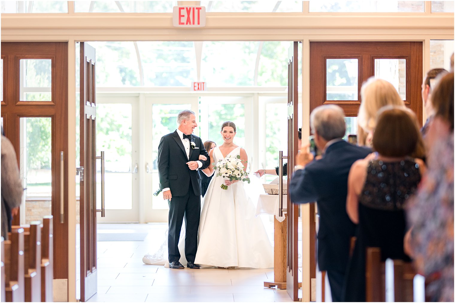 bride and dad enter wedding ceremony