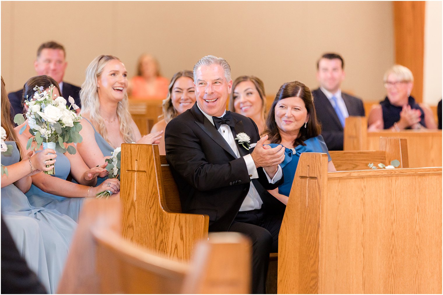 father claps during traditional wedding ceremony at the Church of the Presentation