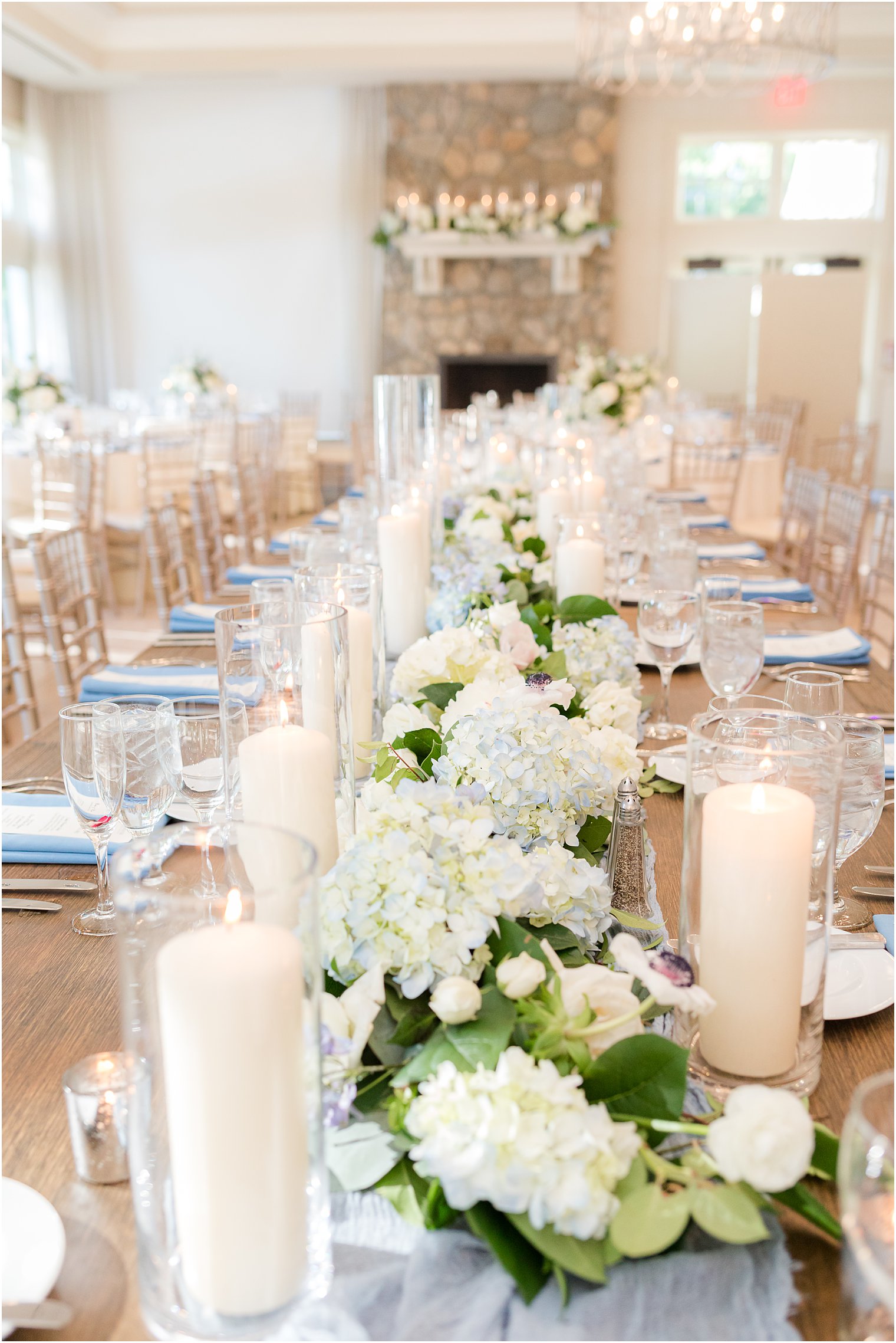 family style seating at Indian Trail Club with white and blue floral runner
