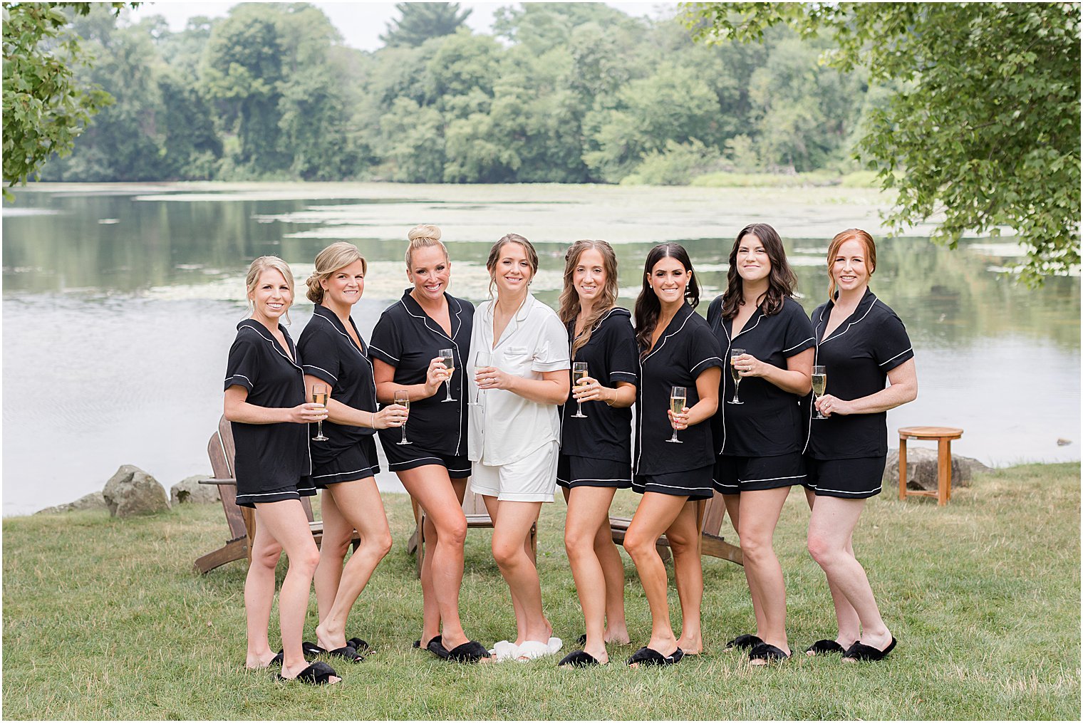 bride and bridesmaids pose in matching pajamas at Indian Trail Club