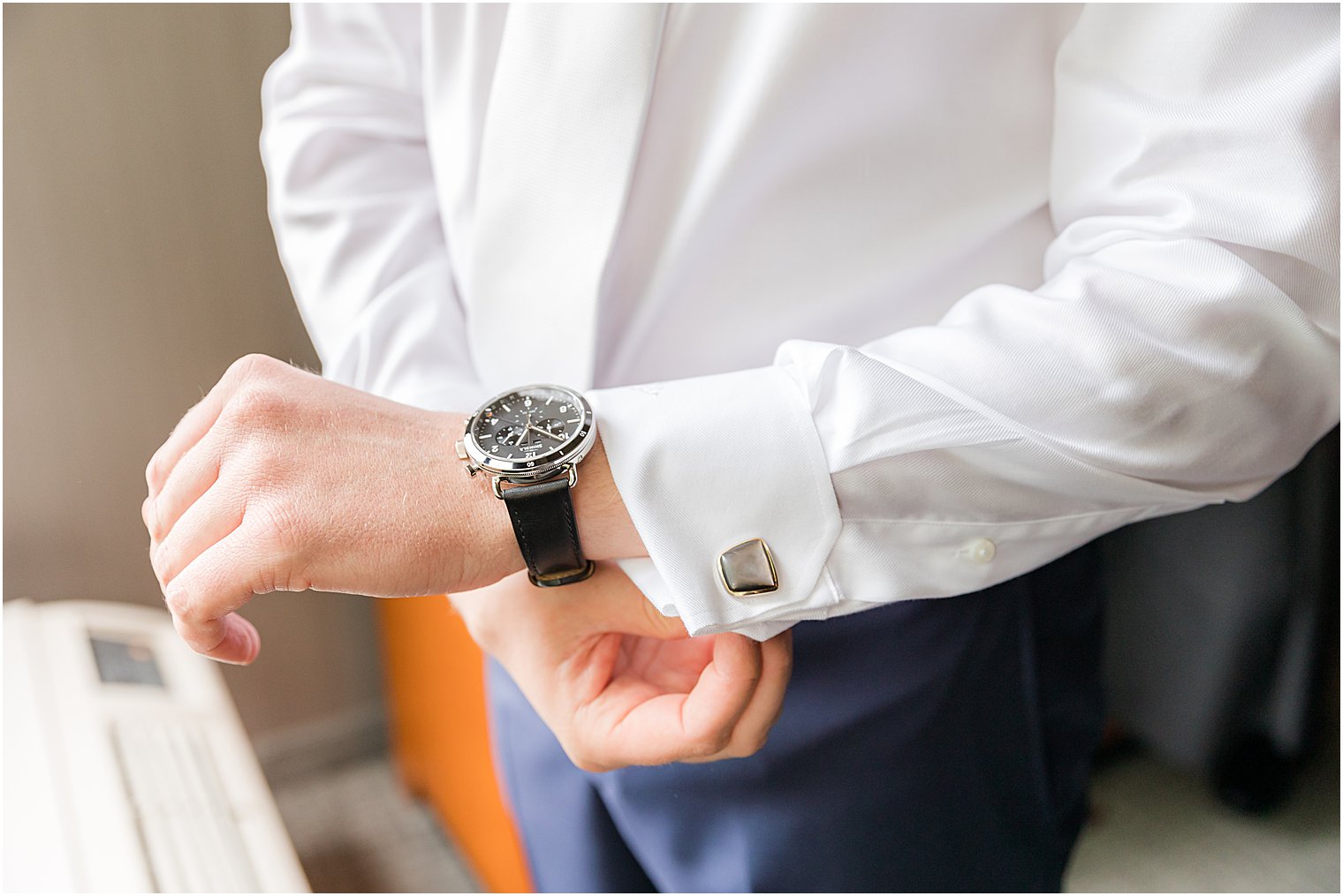 groom adjusts watch before NJ wedding day