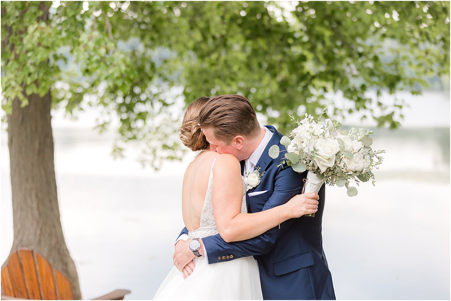 groom and bride hug during first look