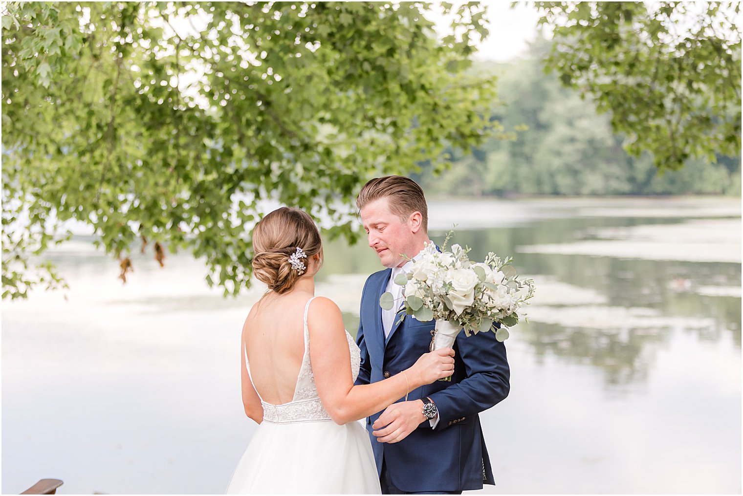 couple laughs together during first look at Indian Trail Club
