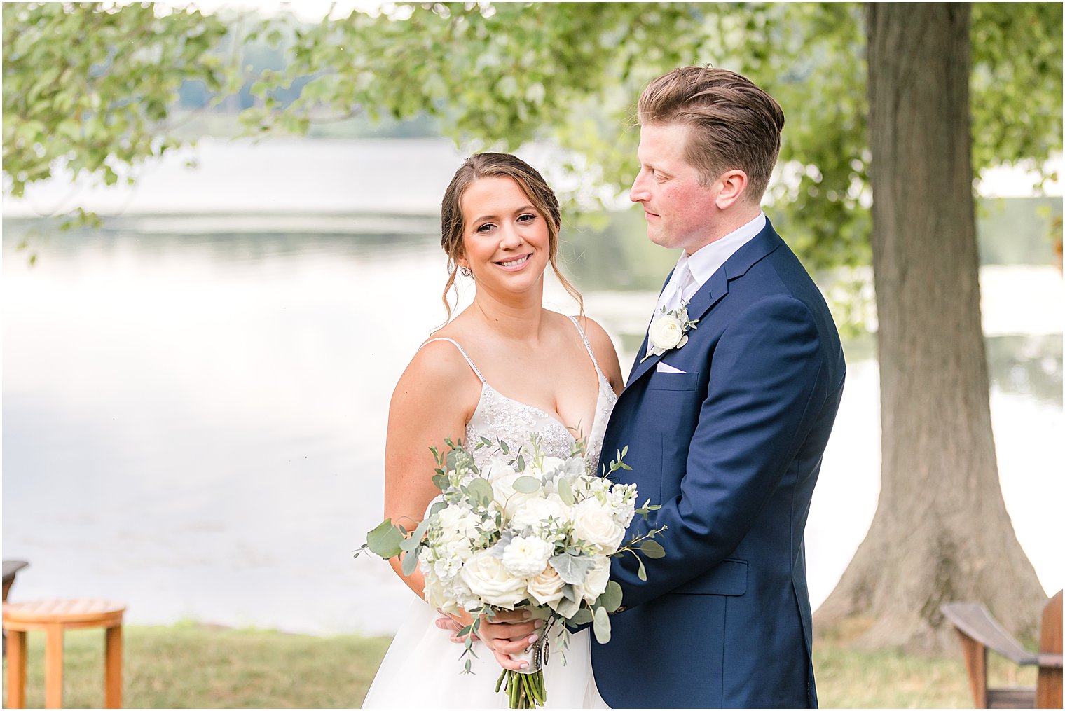 groom looks at bride during summer Indian Trail Club wedding 