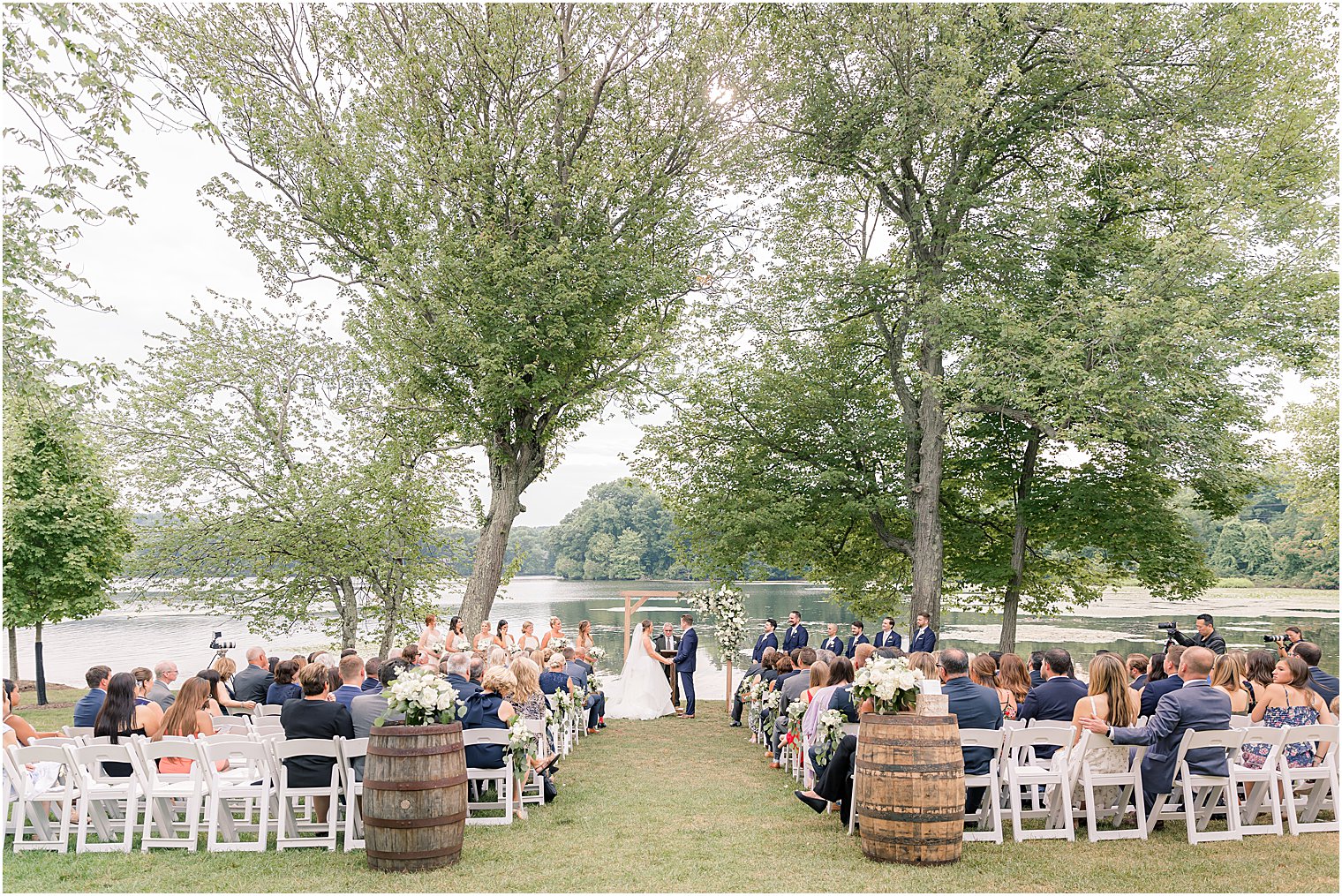 outdoor wedding ceremony by water at Indian Trail Club