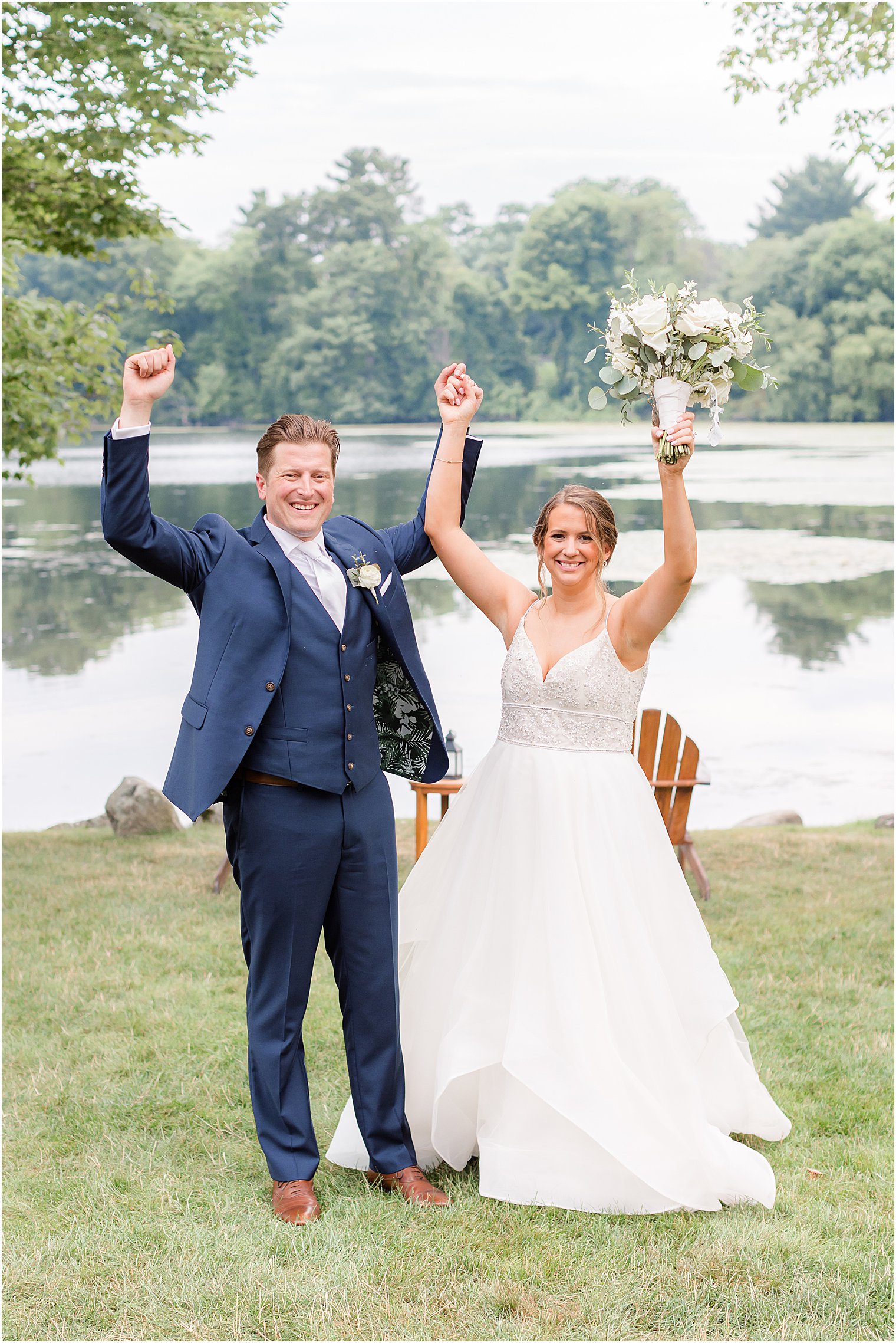 newlyweds cheer during portraits in Franklin Lakes, NJ