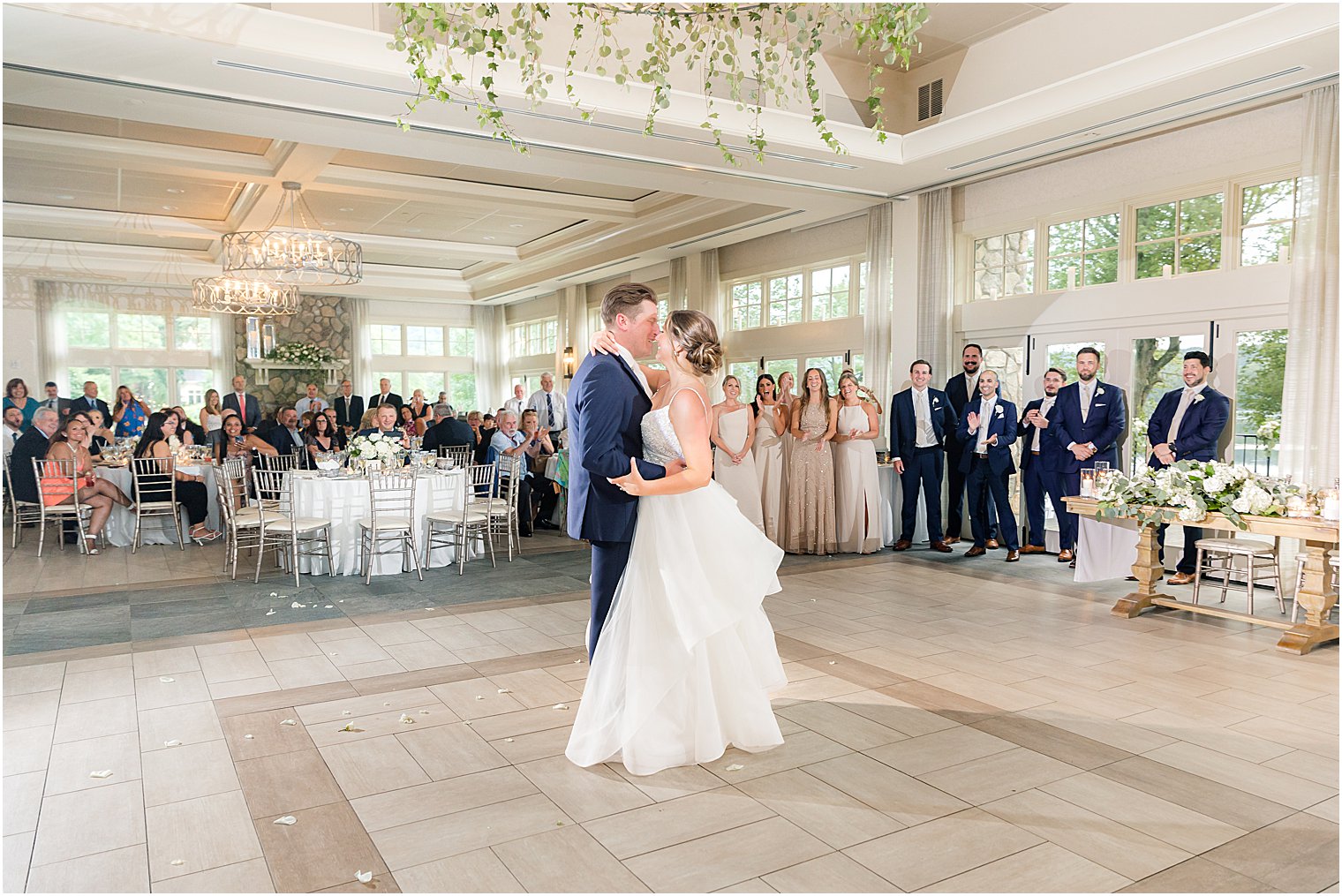 bride and groom kiss on dance floor at Franklin Lakes, NJ wedding reception