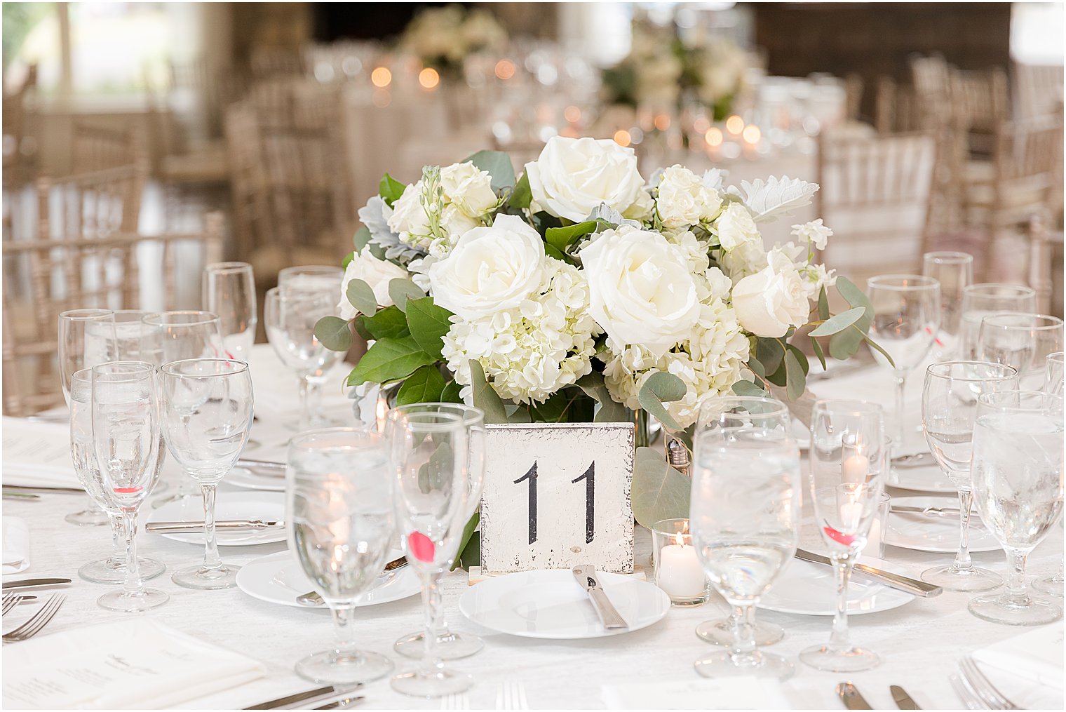 ivory centerpieces with table numbers for Franklin Lakes, NJ wedding reception