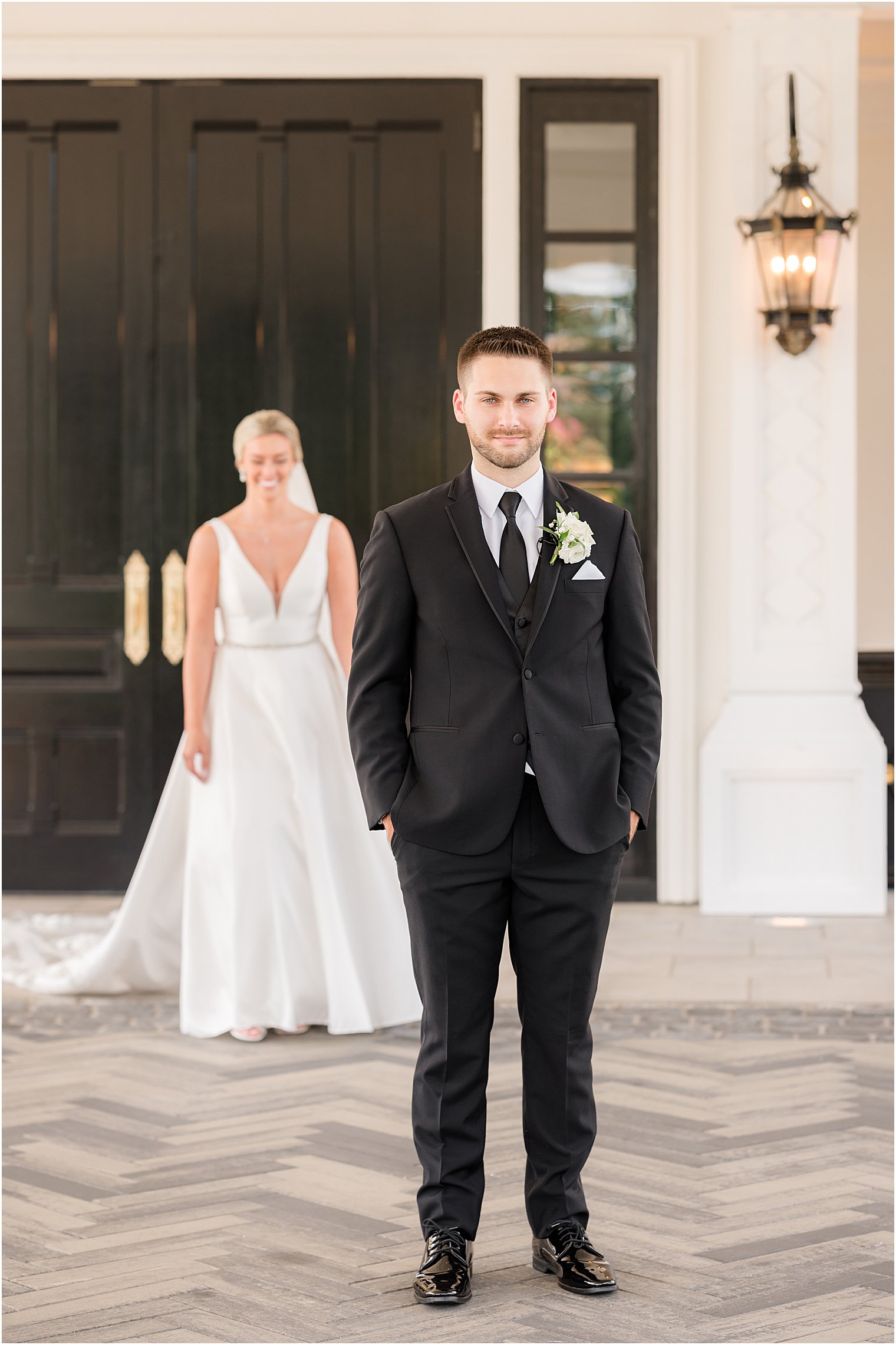 bride approaches groom for first look