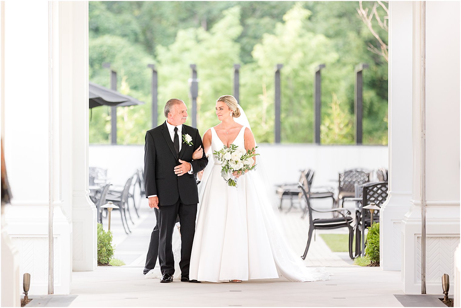 bride and father walk down aisle at Shadowbrook at Shrewsbury